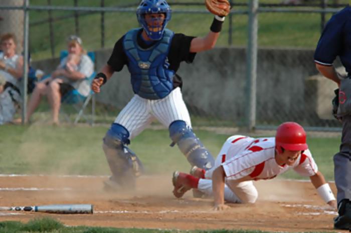 Junior Dereck Carr slides safely as Billy Stevens makes the tag for the Tigers.