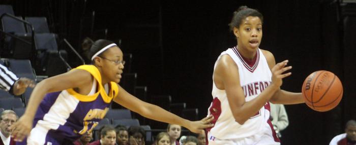 Whitney Malone runs point for Munford.