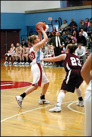 Karly Stache looks to make a pass against Bearden.