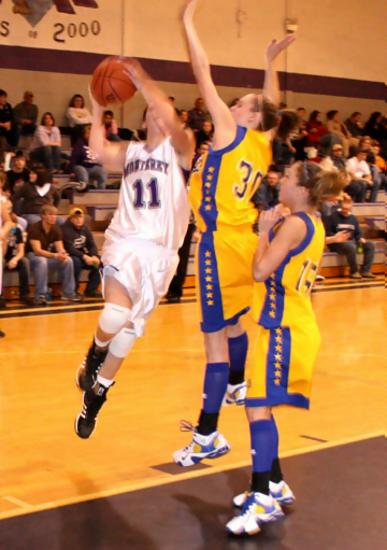 Molly Heady shoots over Tasha Phillips
