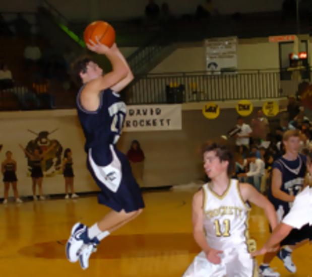 UH's senior guard, Aaron Woodacre, sinks another shot in the paint.