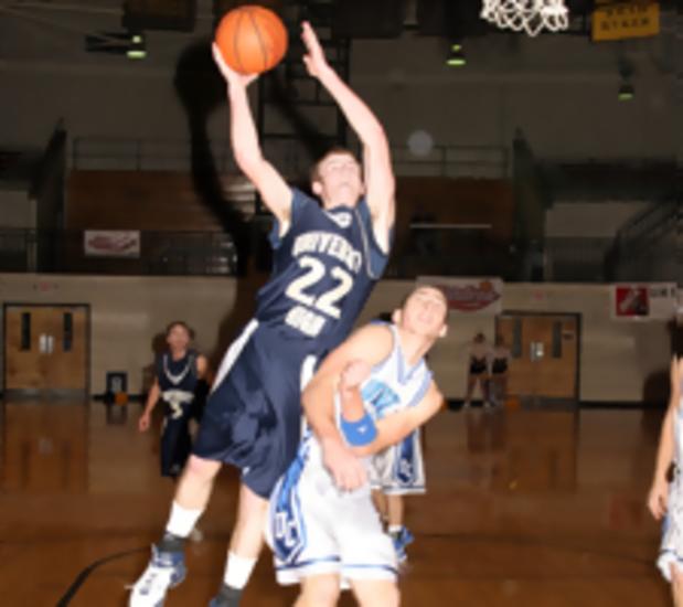 Jr. Bucs Senior, Otha King, takes a foul while laying in 2 points.