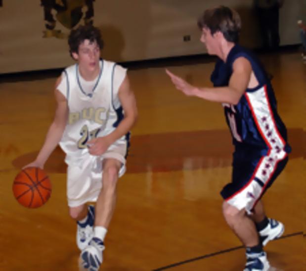 One of East Tennessee's best high school players, Aaron Woodacre, drives in on a Sullivan East defender.
