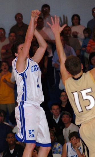 Harpeth's Cody Hudson (2) sinks a jumper as Sycamore's Murray Harris goes up to defend